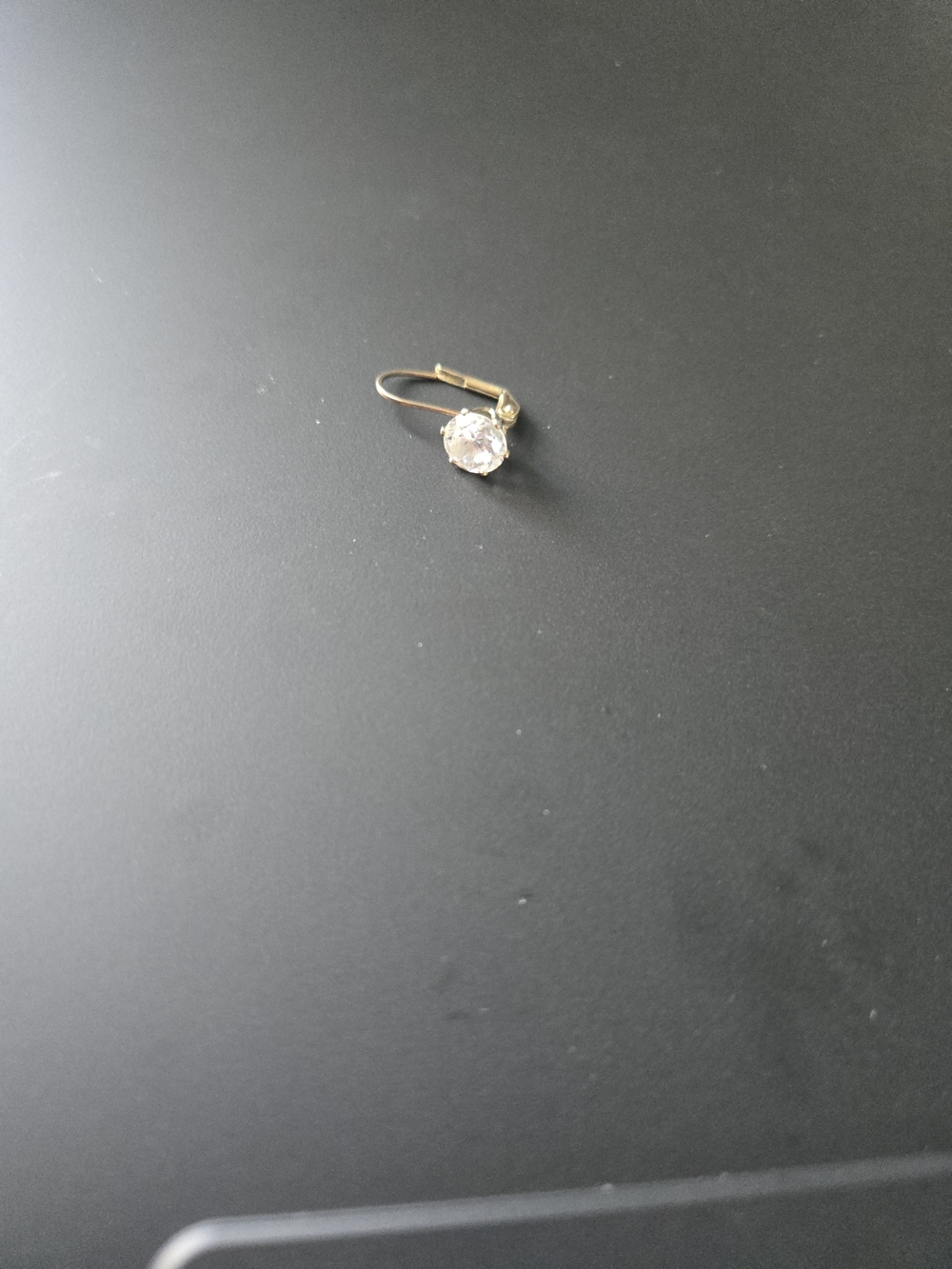 Single Replacement gold-toned leverback solitaire drop earring.
